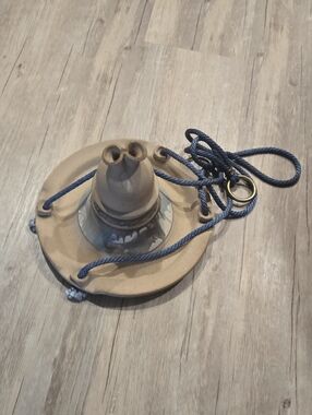Ceramic Hanging Bird Feeder in Tan with Blue Cord.